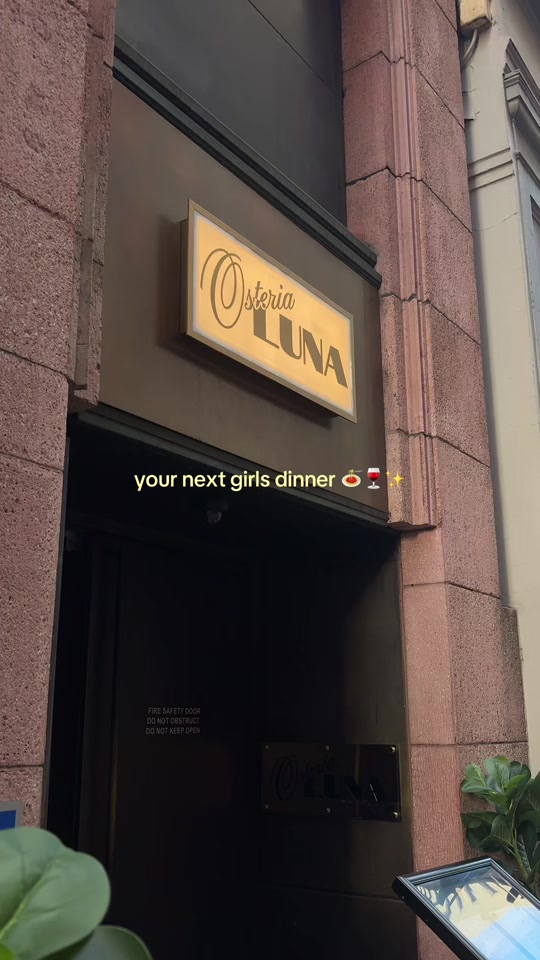 Guest media thumbnail showing Osteria Luna exterior signage